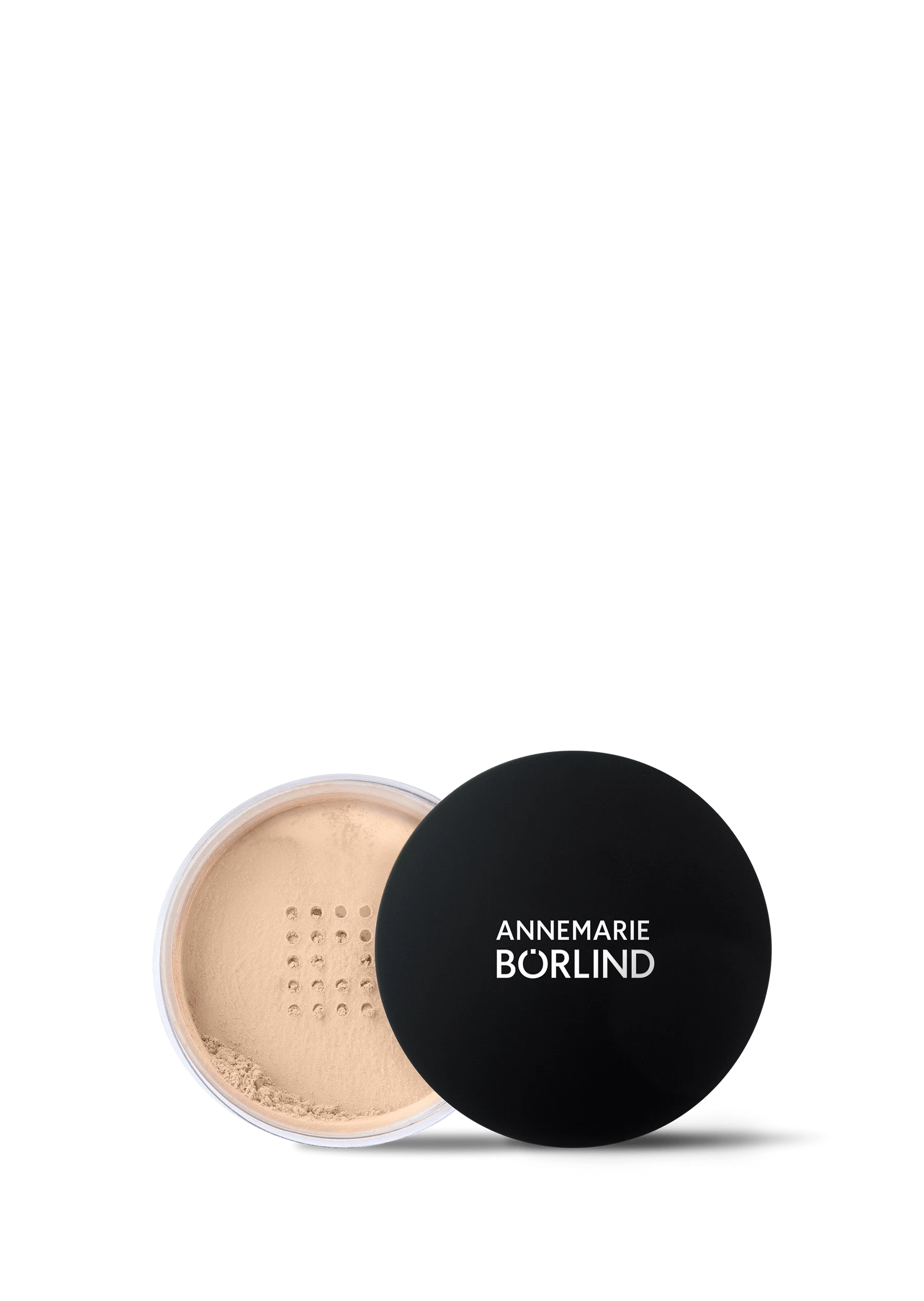 ANNEMARIE BÖRLIND loser Puder Teint Light in geöffneter Dose mit schwarzem Deckel auf schwarzem Hintergrund