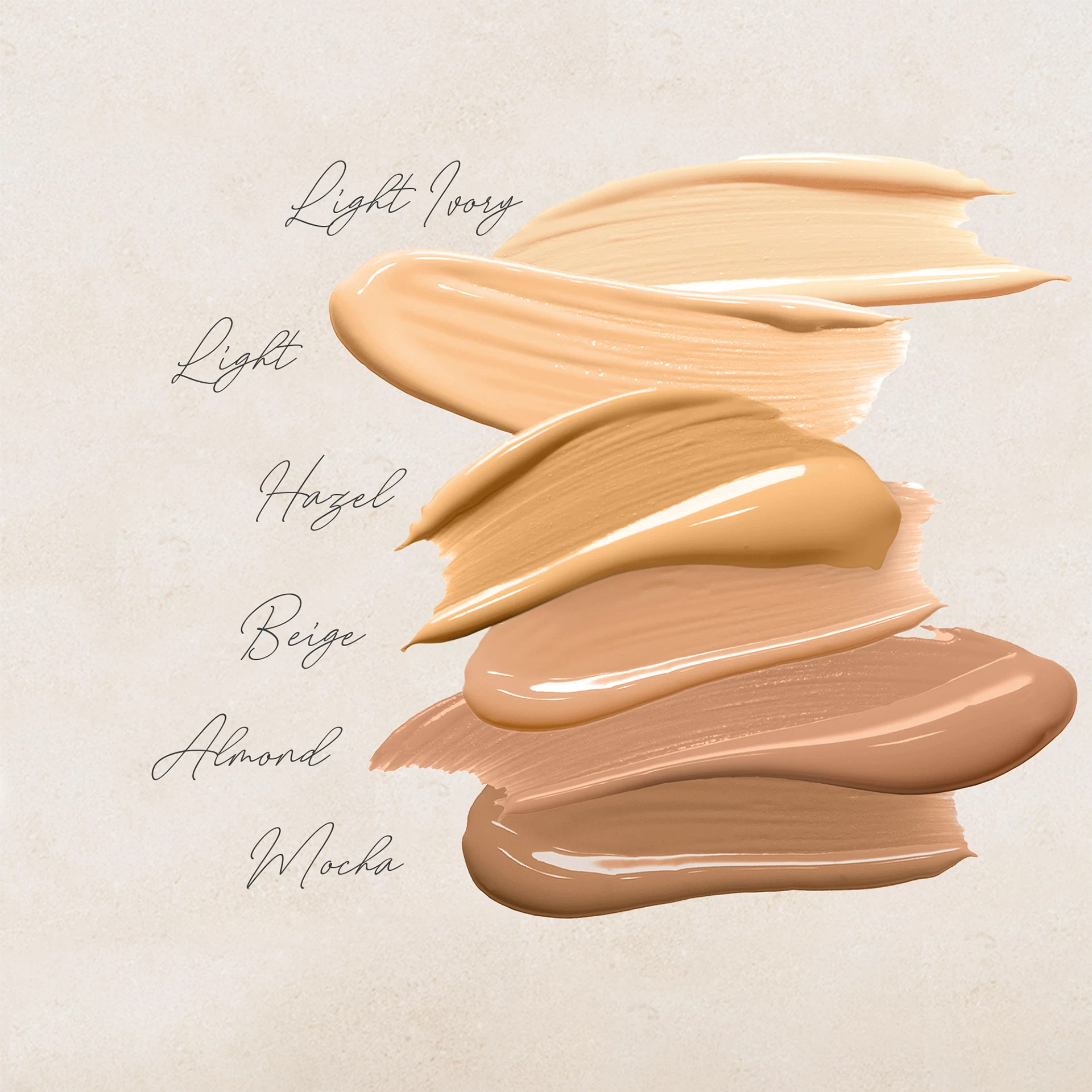 Sechs Foundation-Farbschichten in Light Ivory, Light, Hazel, Beige, Almond und Mocha auf hellem Hintergrund