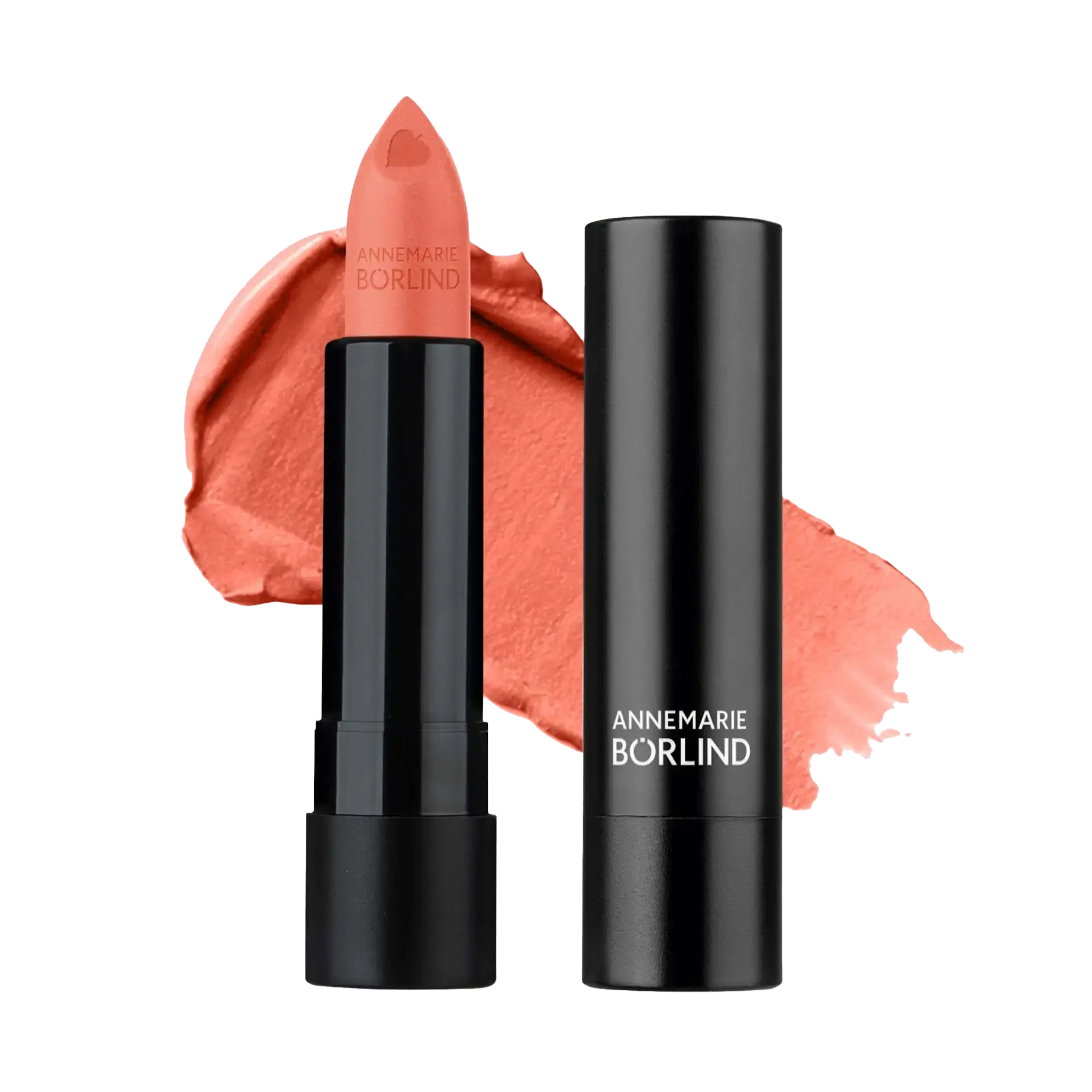 ANNEMARIE BÖRLIND Lippenstift in Pfirsich mit Herzprägung und schwarzer Hülse vor Lippenstiftfarbe