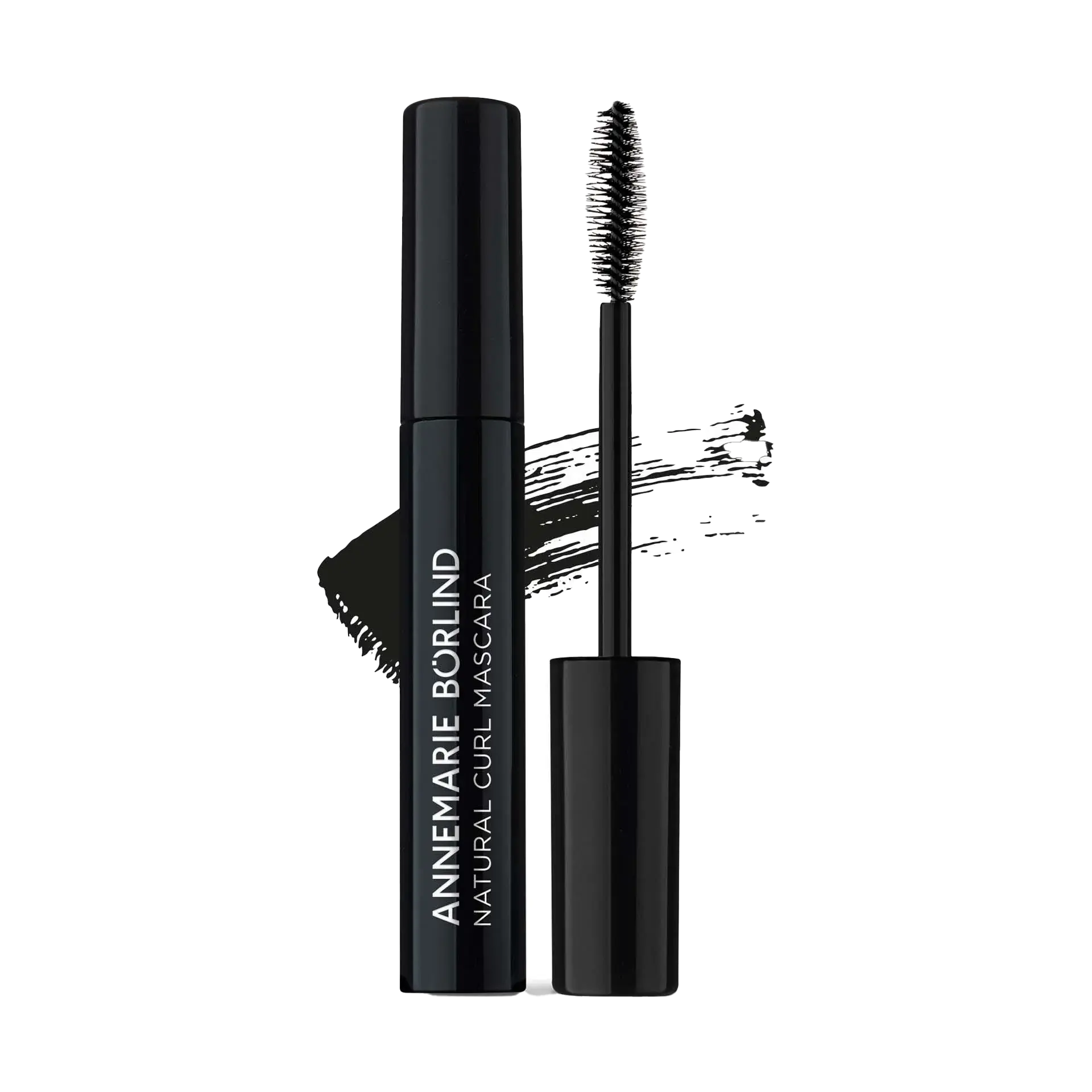 ANNEMARIE BÖRLIND Natural Curl Mascara in Schwarz mit Bürste und schwarzem Farbstrich im Hintergrund