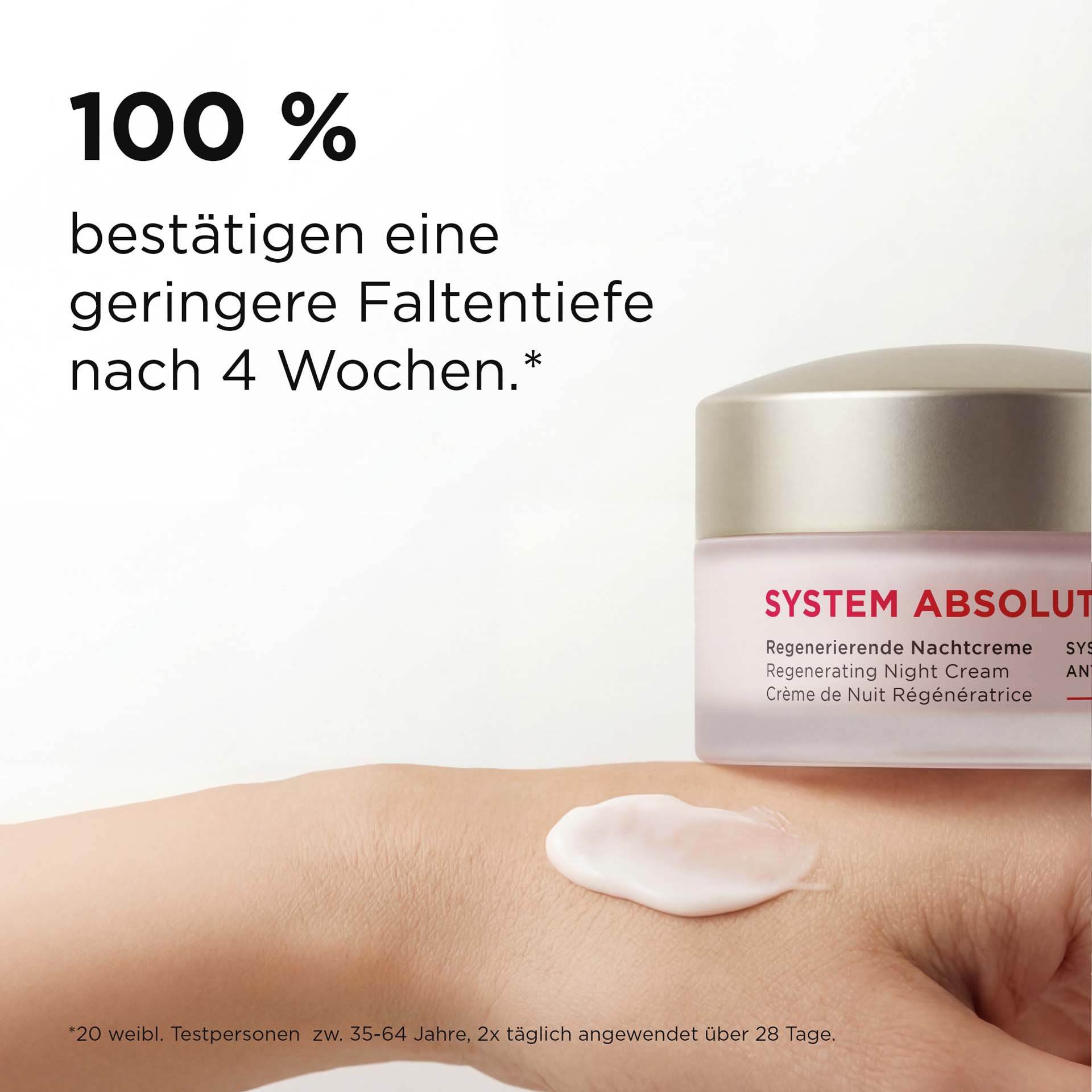 SYSTEM ABSOLUTE regenerierende Nachtcreme im 50-ml-Tiegel mit Anti-Aging-Effekt und silbernem Deckel auf Hand mit Wirksamkeit
