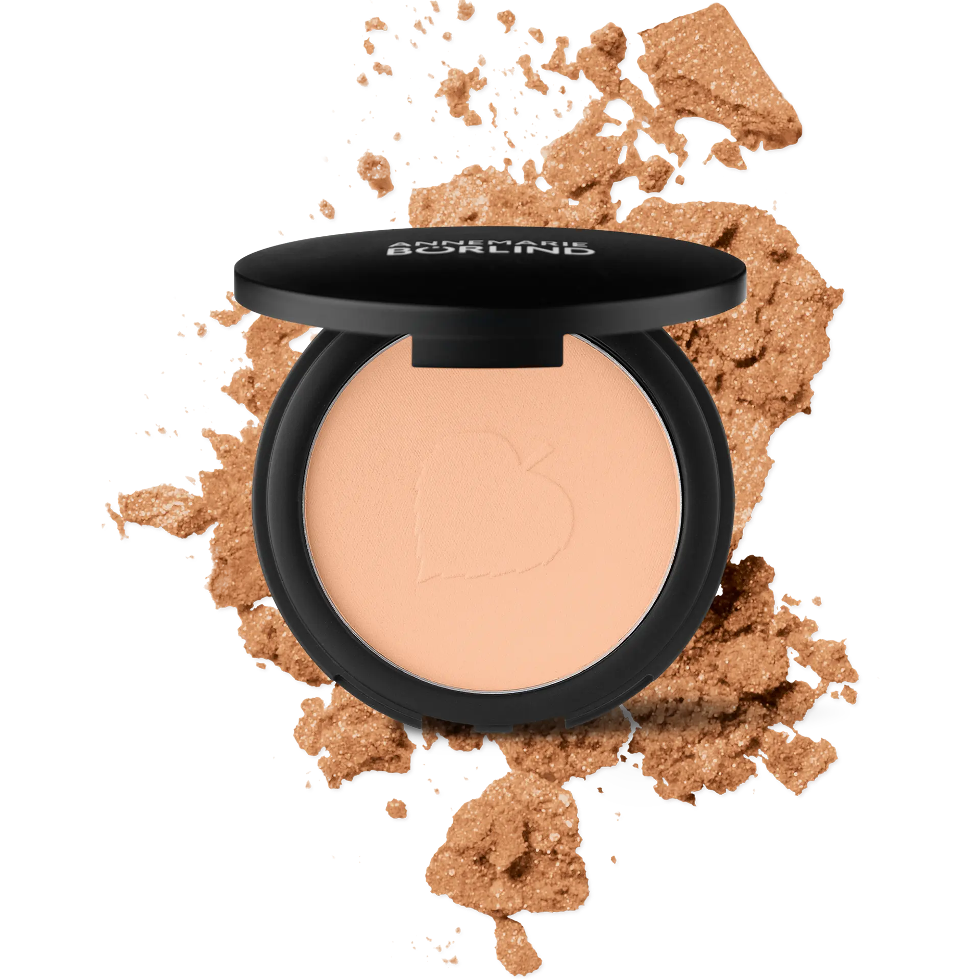 ANNEMARIE BÖRLIND Compact Powder Teint in Beige mit schwarzem Deckel und zerbröseltem Puder im Hintergrund