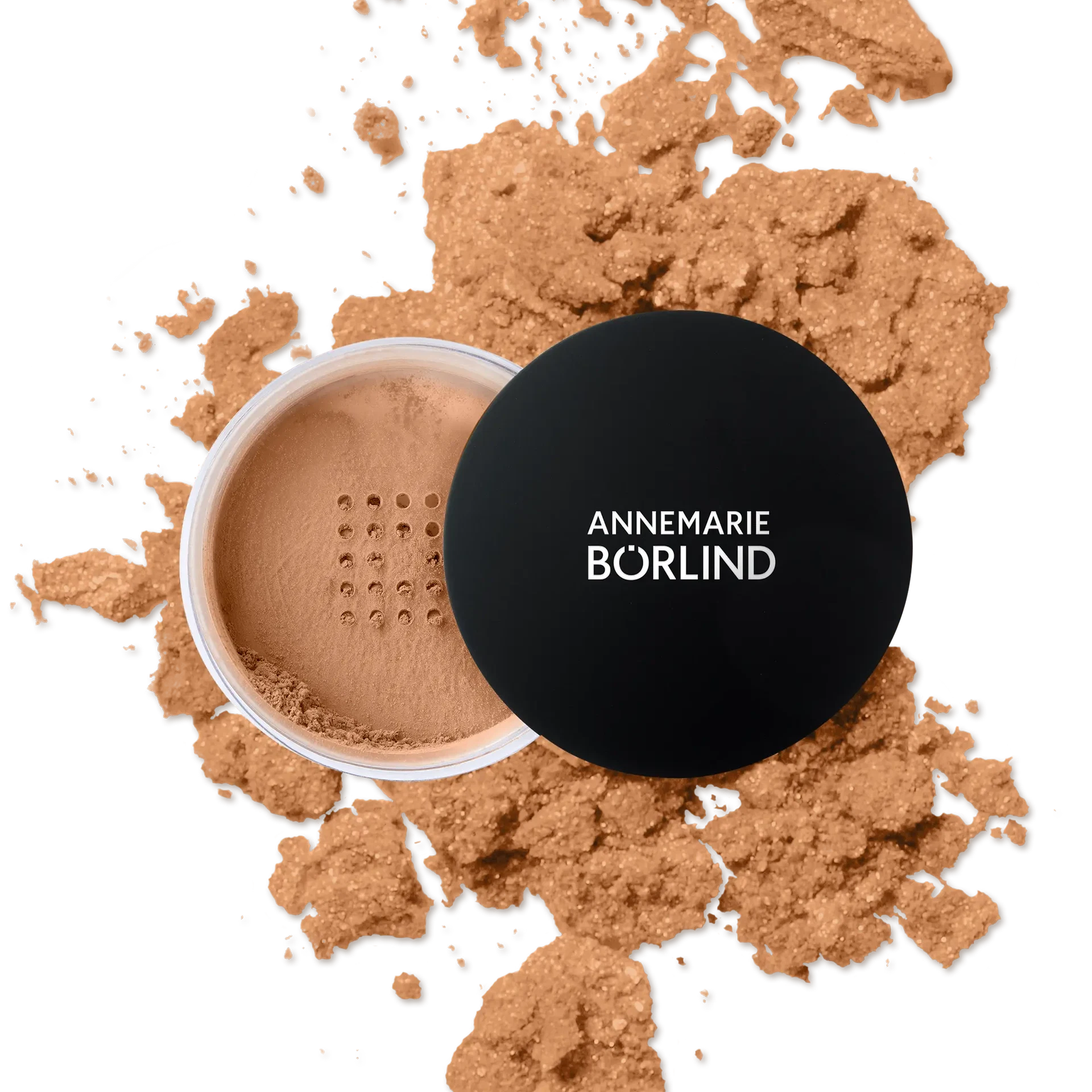 ANNEMARIE BÖRLIND loser Make-up Puder in Mandelton mit schwarzem Deckel und verstreutem Puder