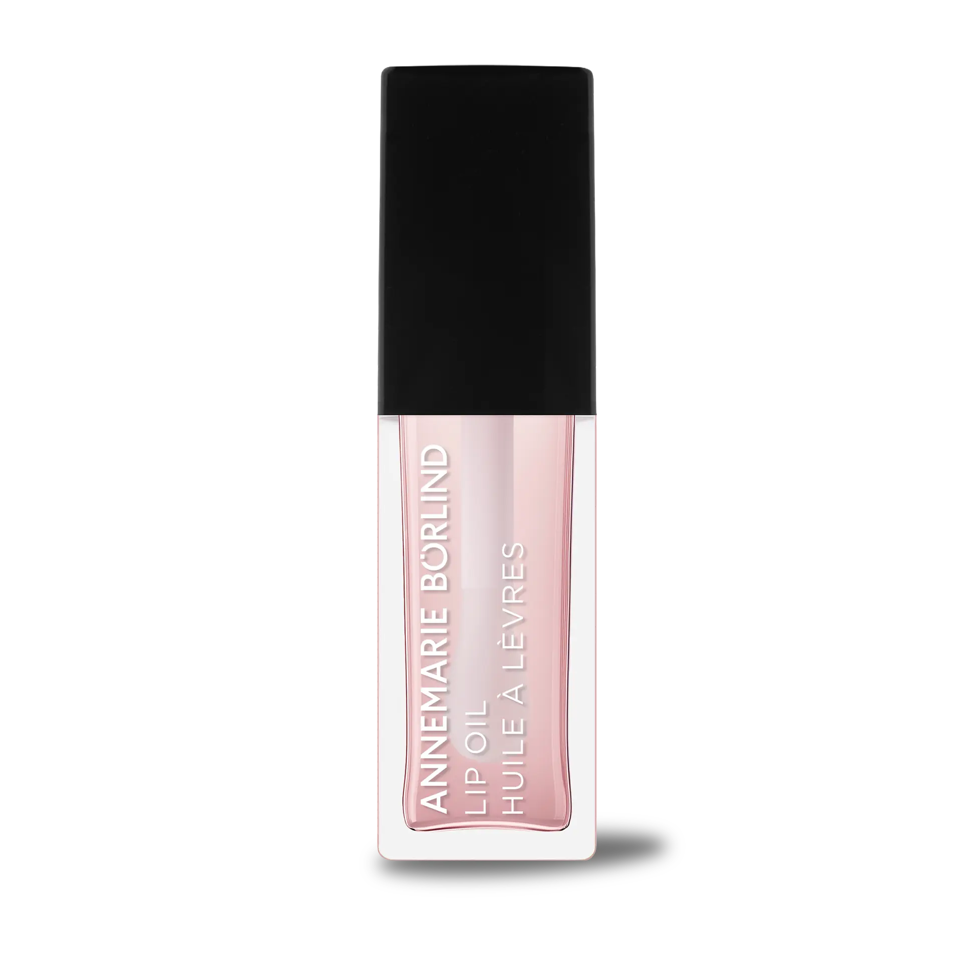 ANNEMARIE BÖRLIND Lip Oil Cherry Blossom in durchsichtiger Tube mit schwarzem Deckel und weißer Schrift