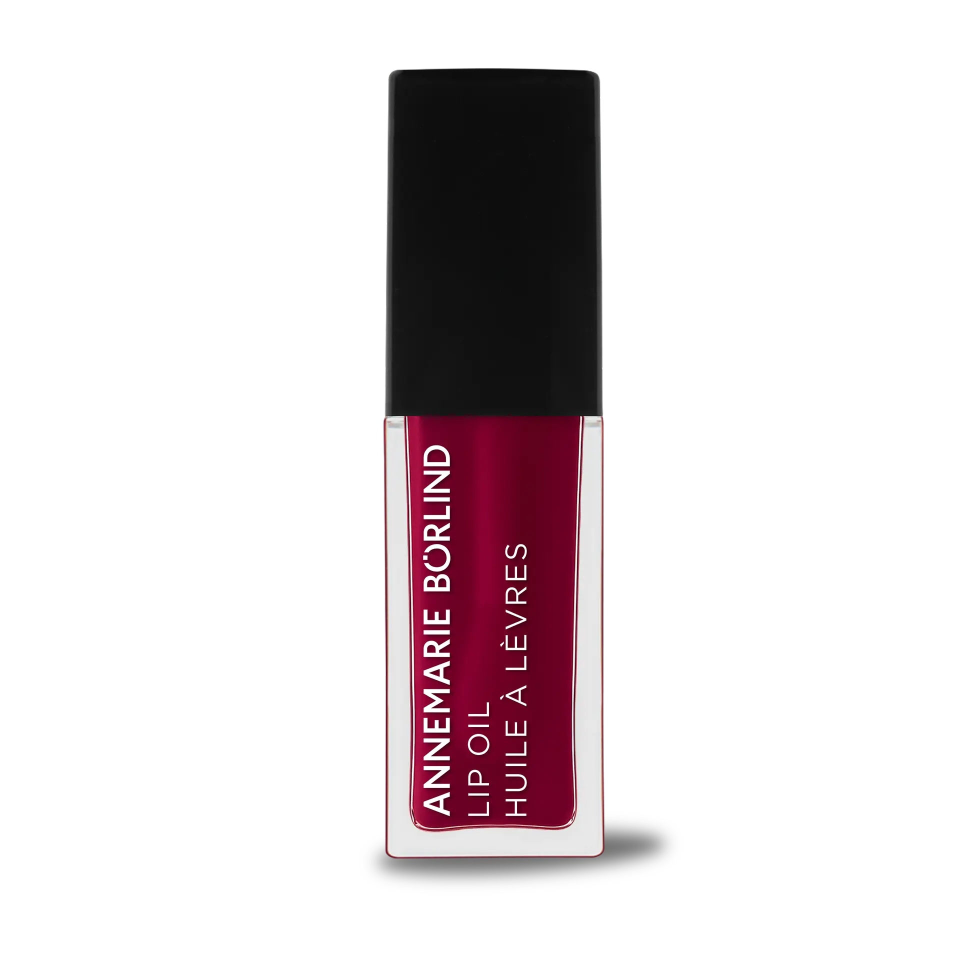 ANNEMARIE BÖRLIND Lip Oil Wild Fuchsia in durchsichtiger Tube mit schwarzem Deckel und weißer Schrift